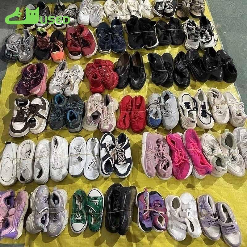 Used mixed footwear separated into cleaning and sale-ready value tiers