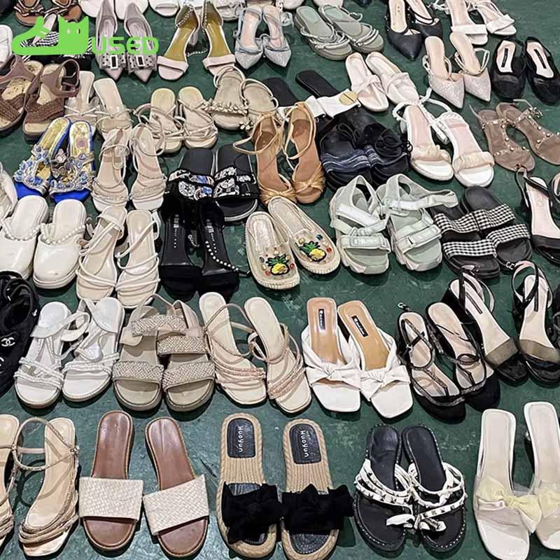 Used shoes sorted into categories before wholesale packing